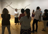 Leslie Elsasser leading a tour in the CAM Gallery.